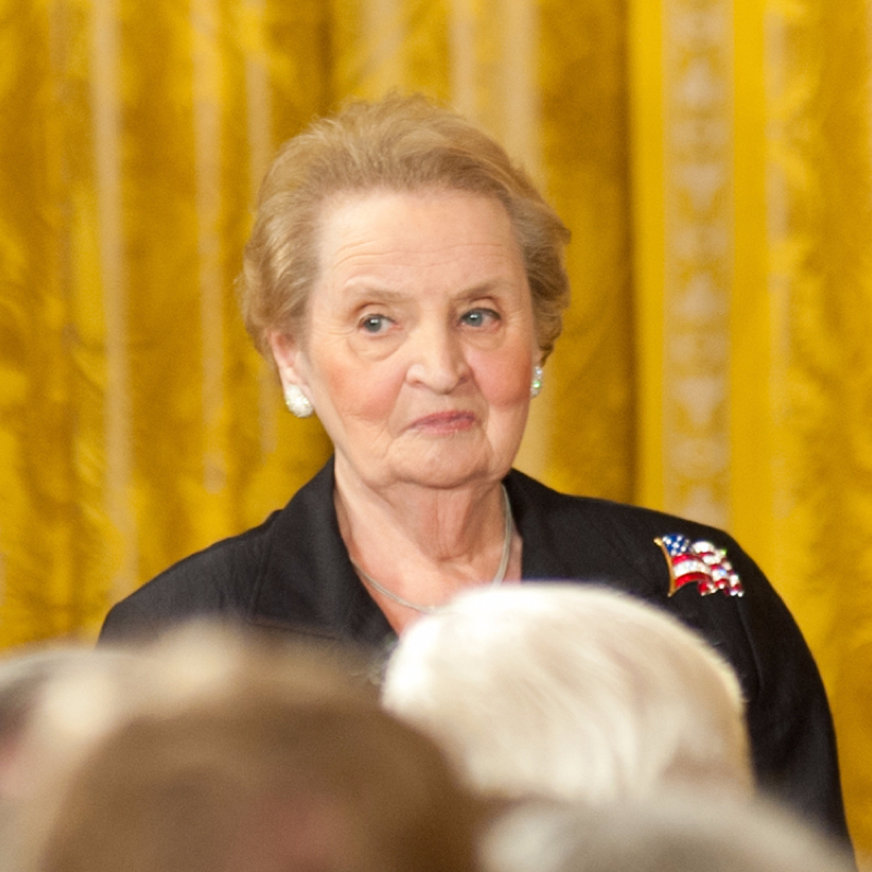Madeleine Albright wearing a USA flag brooch