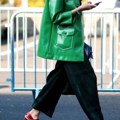 Woman wearing a green raincoat for any weather.