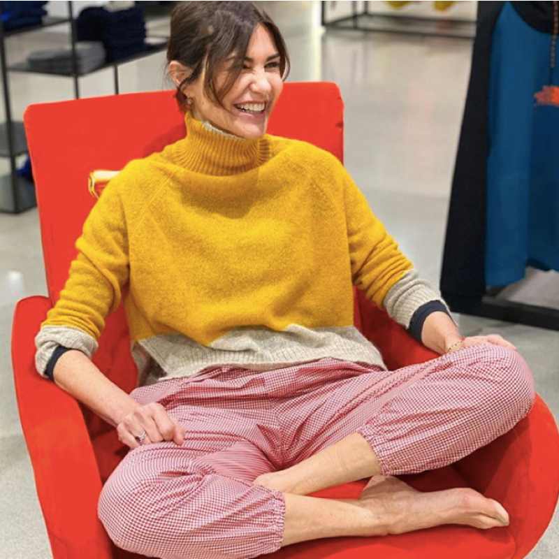 Fashion influencer wearing oversized yellow turtleneck and Gingham trousers; a relaxed but stylish outfit to stay home