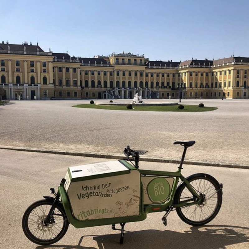Food delivery bicycle in front of Schönbrunn Palace in Vienna
