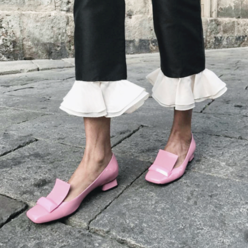 Tamu McPherson wearing pink Rayne flat pumps for a cool chic style.