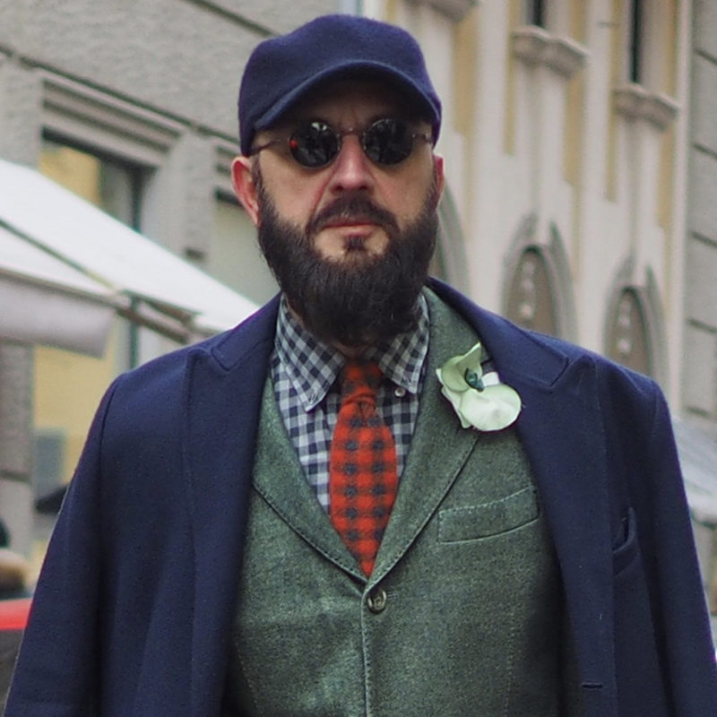 Stylish man wearing a beard at Pitti Uomo in Florence, Italy, before COVID-19.