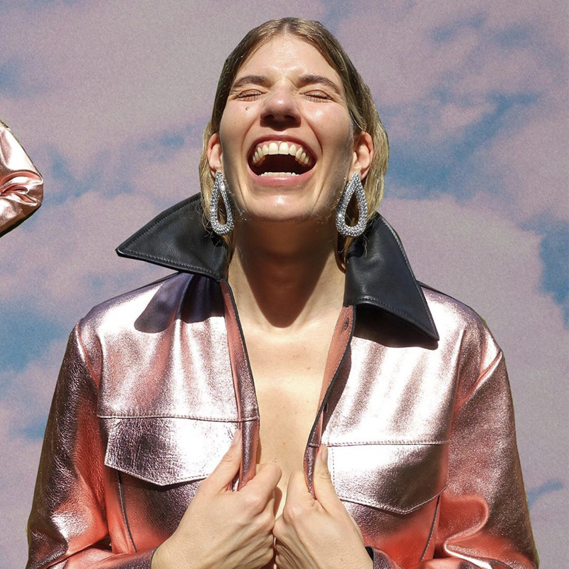 Veronika Heilbrunner, one of the muses of H&M Studio AW 2020, wears a shimmering jacket and statement earrings of the limited edition.