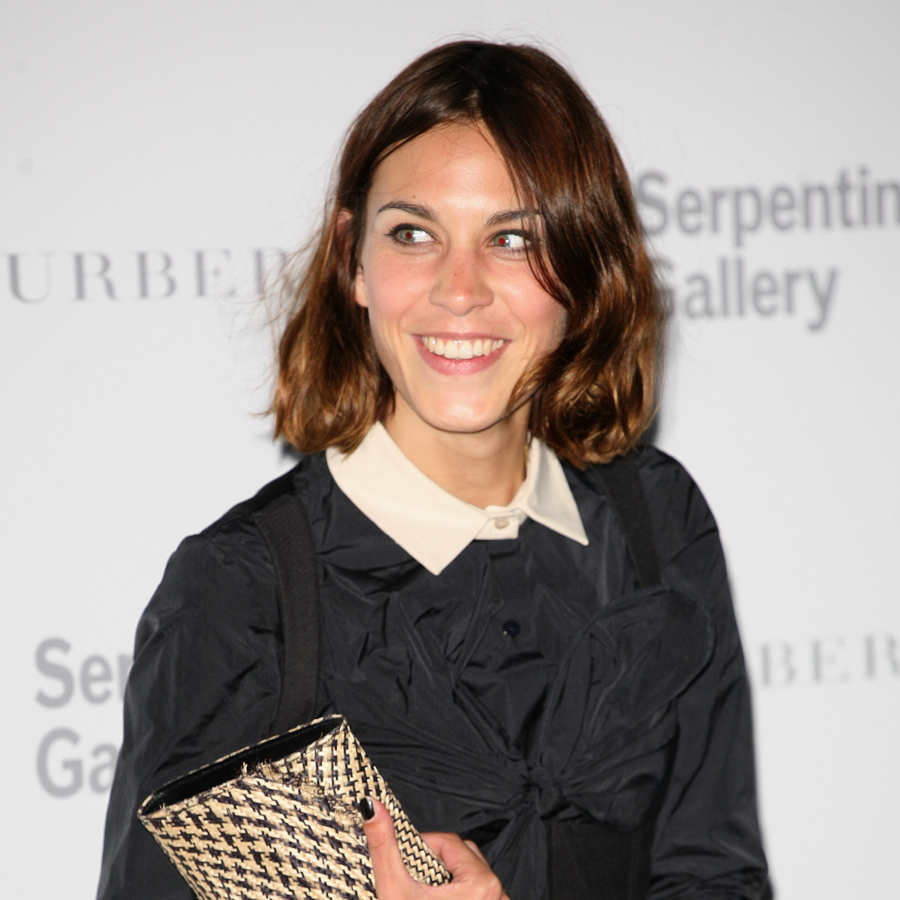 Alexa Chung wearing a black little dress and white collar shirt in the Serpentine Gallery and Burberry event