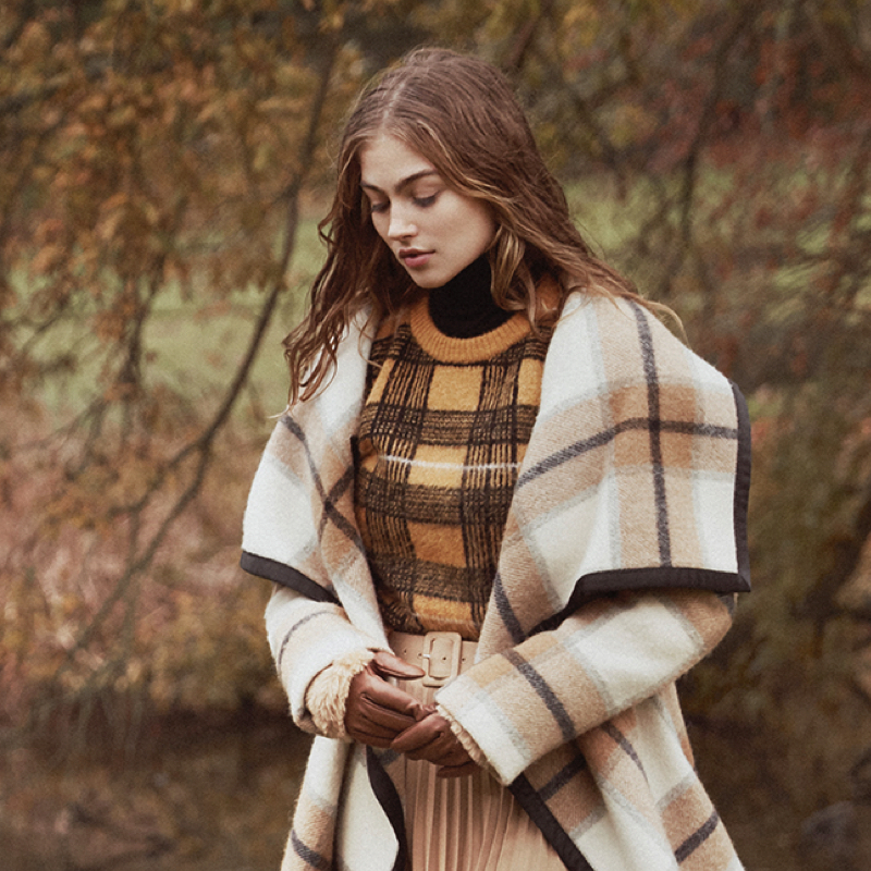 Tartan cape and sweater; winter fashion for countryside and home.