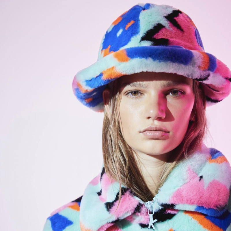 Model wearing faux-fur coat and hat in cheerful colours, by the Korean fashion label, Kirin.