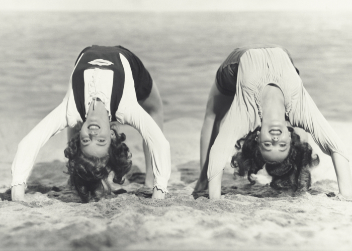 two women having fun on the beach - vintage picture
