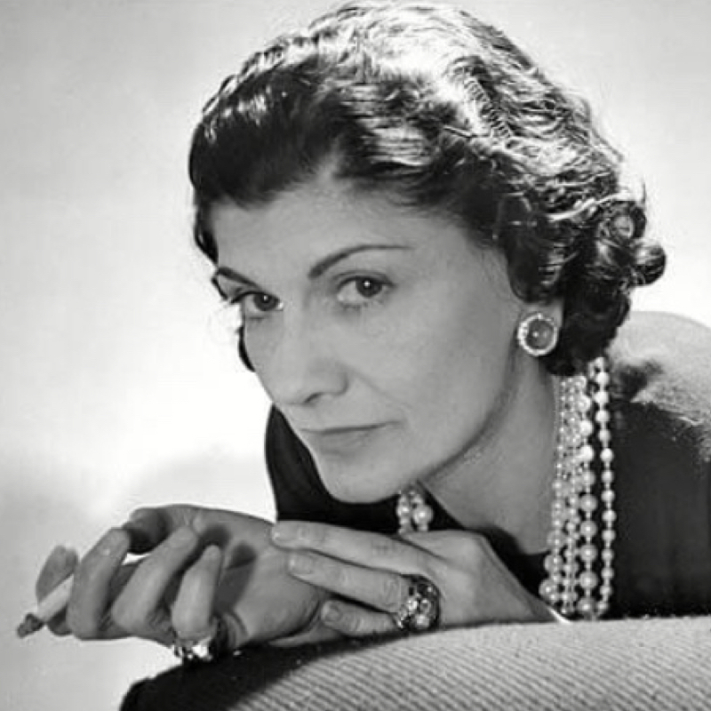 Coco Chanel wearing several costume jewellery pieces made by Goossens and other couture goldsmiths.