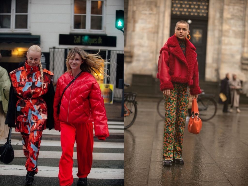 Danish girls in the streets of Copenhagen wearing red outfit in the most colourful street style among all fashion weeks