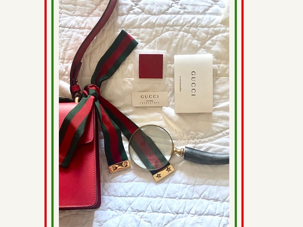 Details of a Gucci bag with authenticity cards.