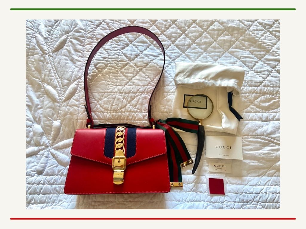 Gucci bag, dust bag, and authenticity cards.