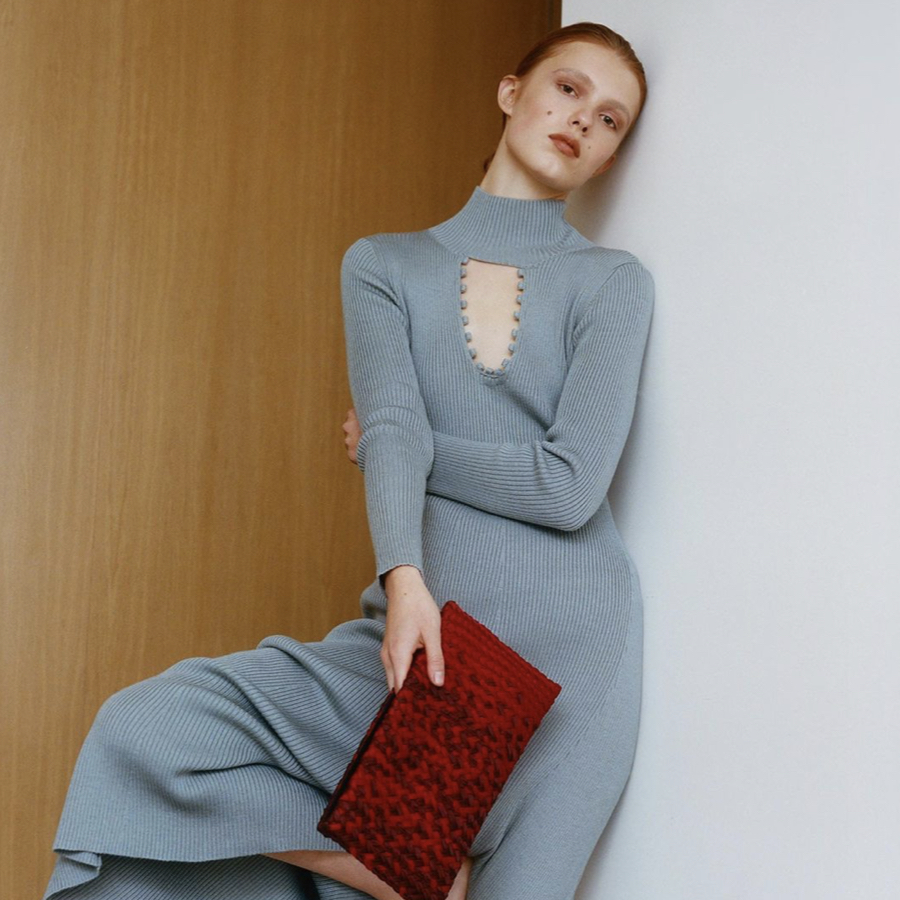 Model wearing a designer knitted dress by Ukrainian fashion brand.