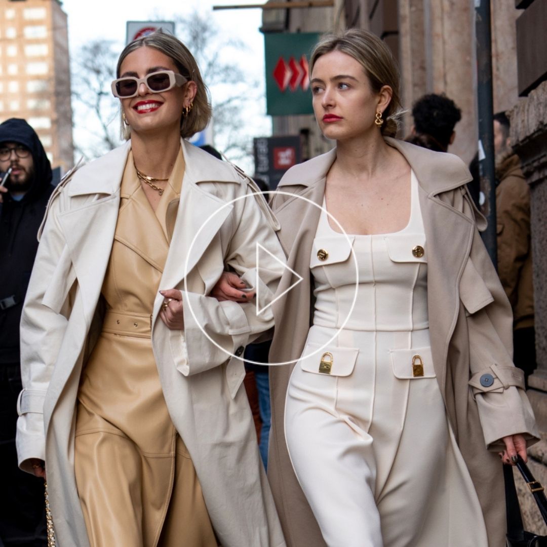 Fashion show goers wearing a timeless staple, the trench coat.