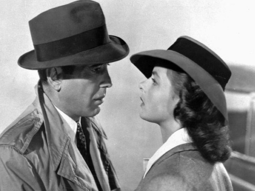 Humphrey Bogart wearing a trench coat in Casablanca.