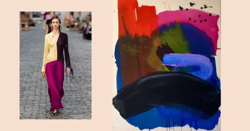 Tory Burch model wearing an outfit with the same colours of the painting beside her.
