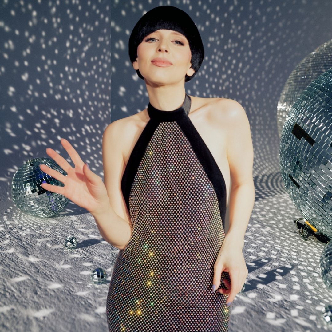 Sparkling fashion at Eurovision 2022 with contestant wearing a halter neck outfit and '60s inspired bob.
