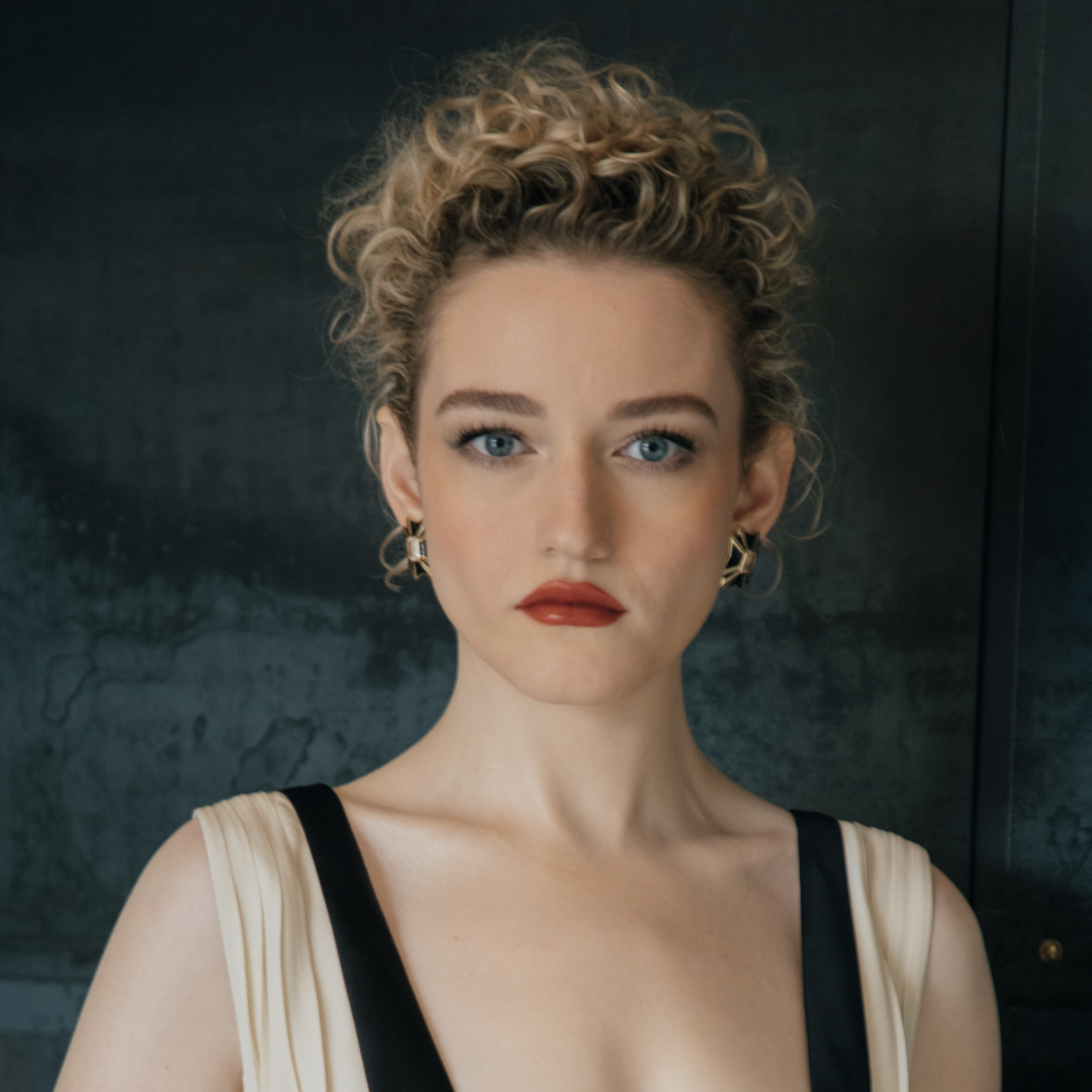 Julia Garner in a luxurious red carpet look and Madonna's blond curly hair.