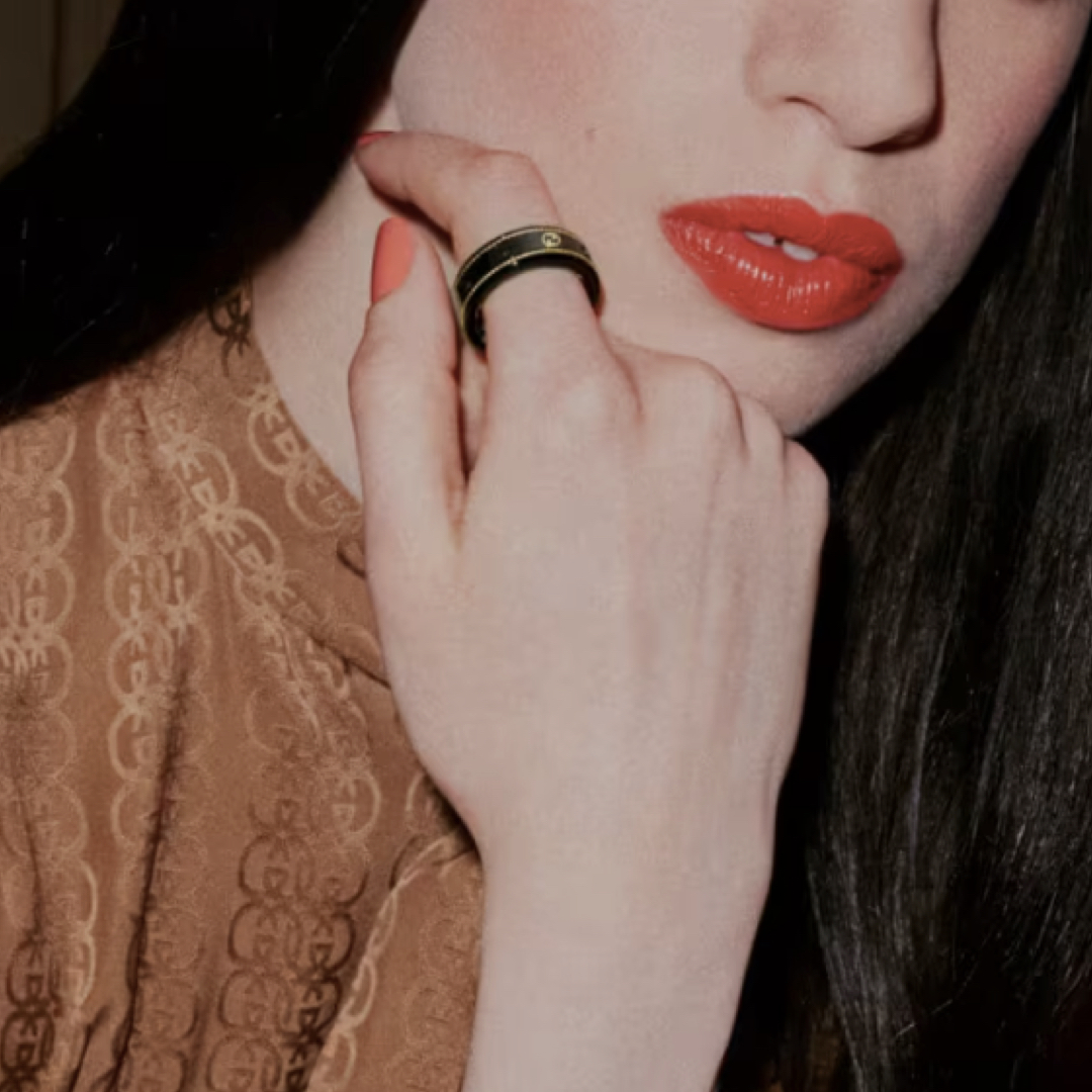 Close up of woman wearing the Gucci ring that monitors health.