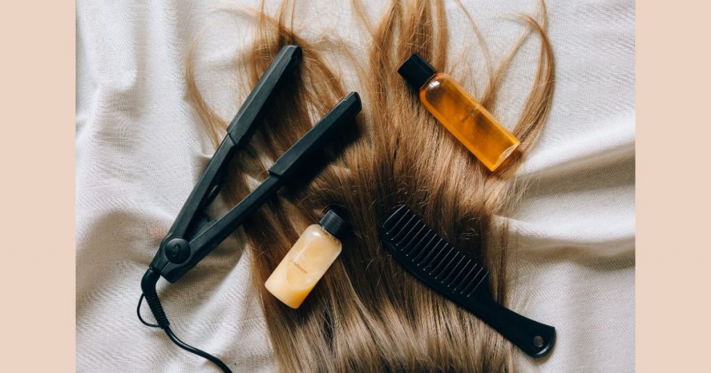 detail of a hair with a iron tool and some hair products