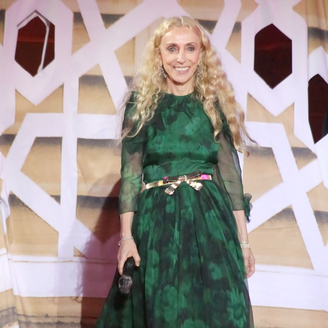 Franca Sozzani wearing a green gown in a fashion event