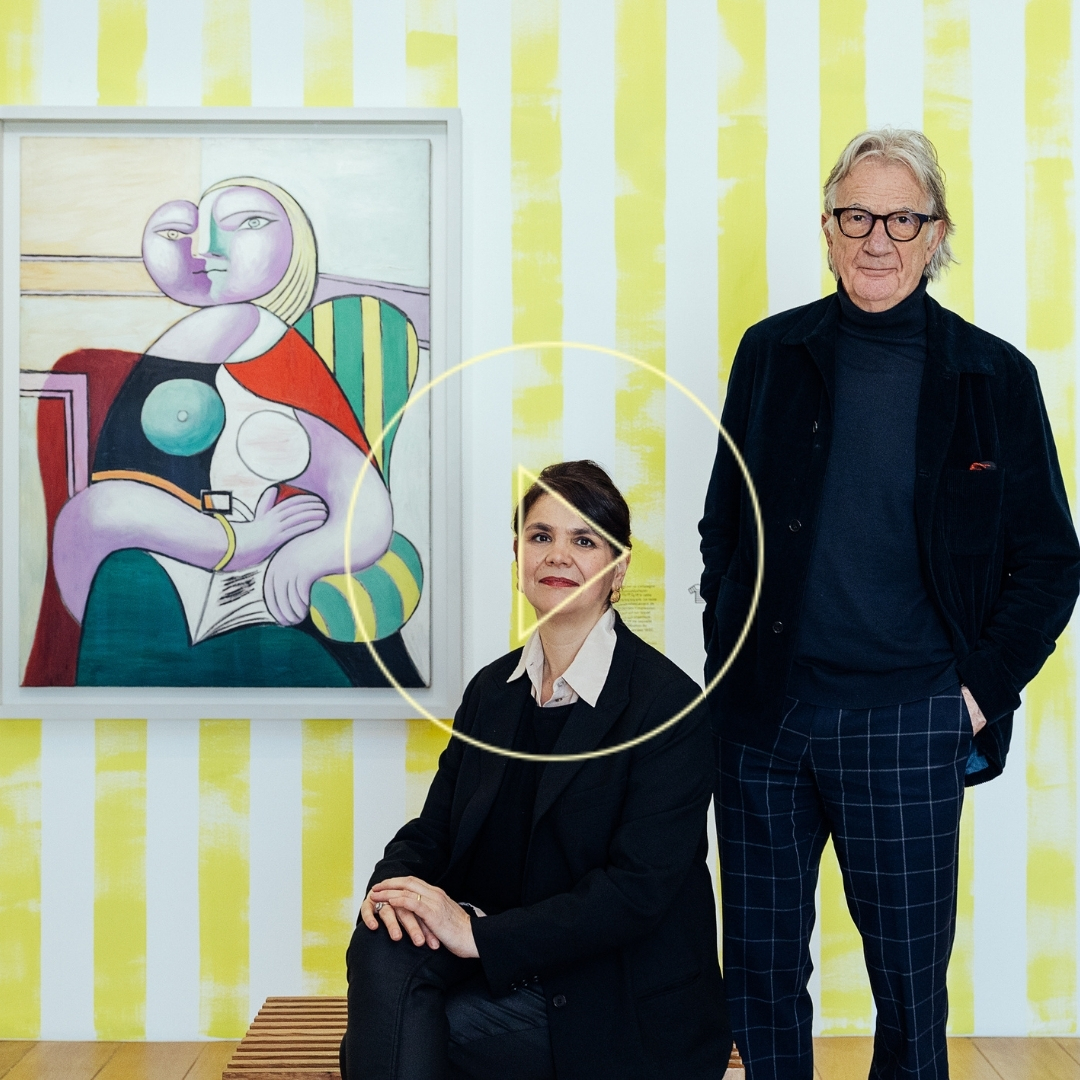 Paul Smith in front of a painting by Pablo Picasso
