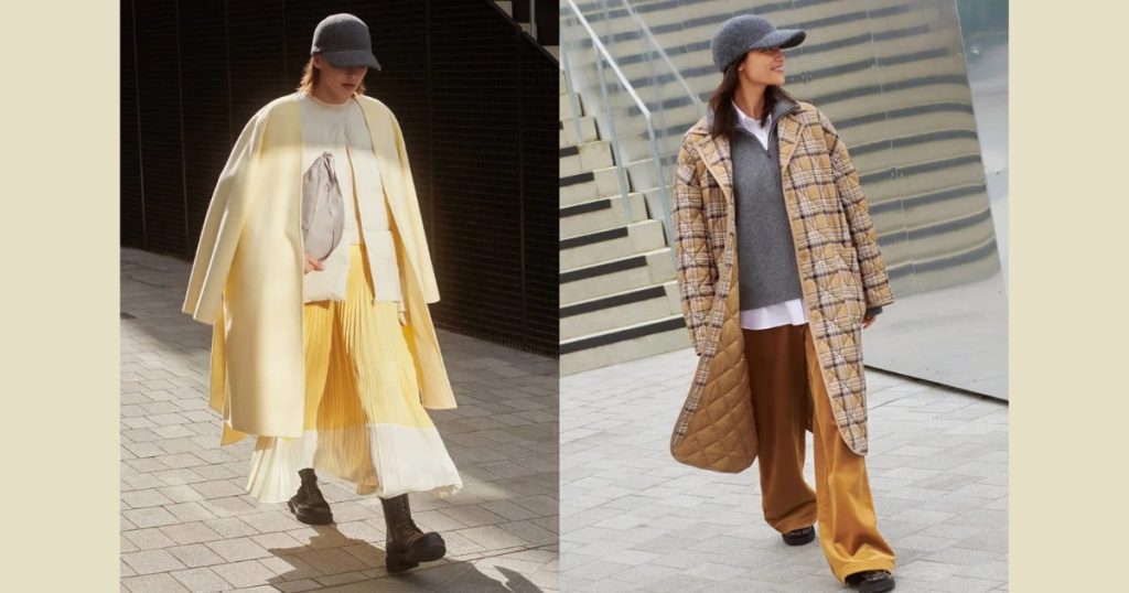 Two photos of Clare Waight Keller and Uniqlo Collaboration. Model 1 wearing a yellow maxi skirt and a yellow coat. Model 2 wearing a trouser , pullover and a checked coat
