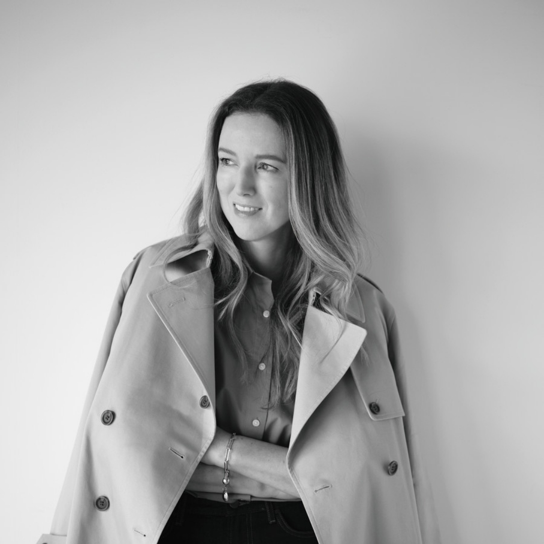Designer Clare Waight Keller wearing a trench coat from her collaboration with Uniqlo